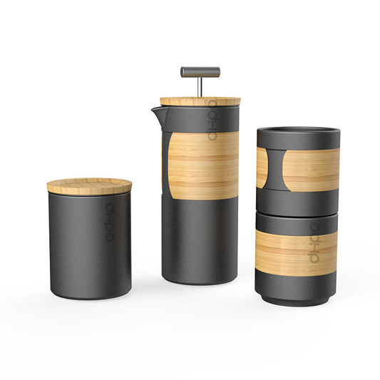 DOHO matte black ceramic coffee press and stackable cups with bamboo accents, compact home coffee setup, minimalist design.