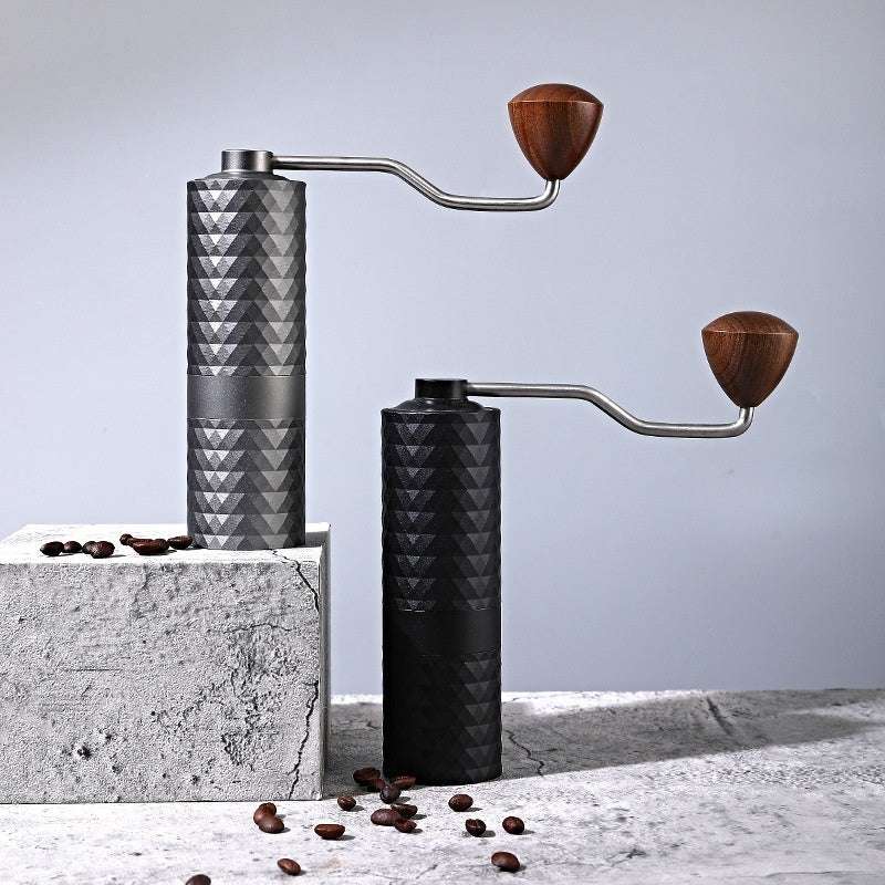 Stylish dark gray and black manual coffee grinders on concrete blocks with coffee beans. Perfect for coffee lovers. #CoffeeGear #Grinders #CoffeeAccessories