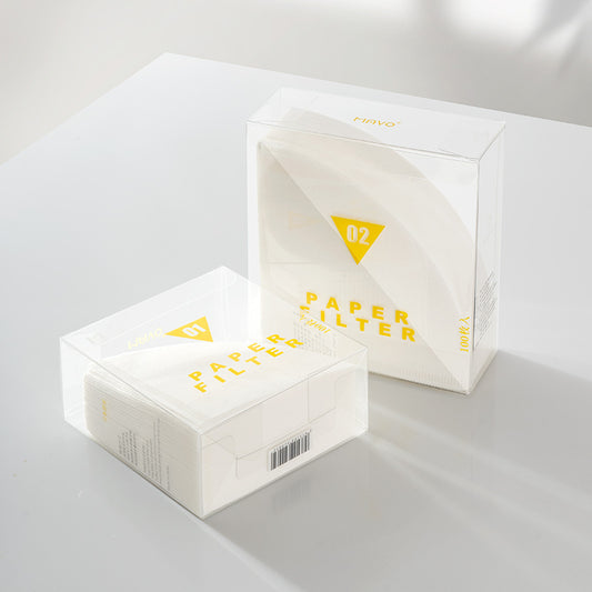 V01 and V02 V-shaped coffee filter papers in their clear packaging. Perfect for home brewing. SHOP NOW