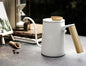 White gooseneck pour-over kettle for manual coffee brewing, home barista essential.