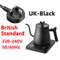 Black electric kettle with UK plug and British Standard voltage information on a white background